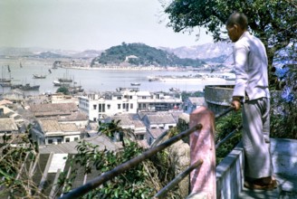 View from Monte Fort over rooftops of high density buildings in city centre, Macau, Asia 1964.