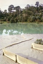 Open Cast gravel-pumping tin mine Malaya, Malaysia, south east Asia 1964 - slurry runs off into