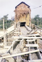 Open Cast gravel-pumping tin mine Malaya, Malaysia, south east Asia 1964 - pumping raises the