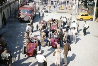 Ferrari Formula One team in paddock with sharknose Ferrari 156 F1 cars, Ferraris, Monza Grand Prix,