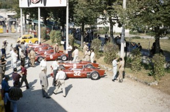 Ferrari Formula One team in paddock with sharknose Ferrari 156 F1 cars, Ferraris, Monza Grand Prix,