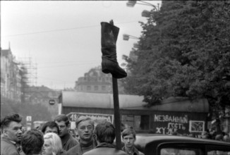 Prague 1968 after the invasion of the Warsaw Pact troops: Man protesting with a boot
