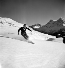 Ski instructor shows proper way to ski, Arosa 1938