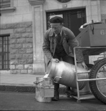 Milkman delivering milk in Geneva 1943