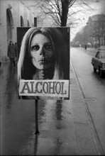 Poster warning of drug abuse has been taped over with the word alcohol, 1969