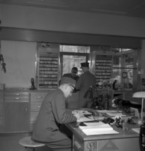 Christmas Eve 1953: counter clerk