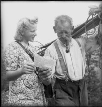 Alpnachstad, postwoman bringing mail to farmers, 1944