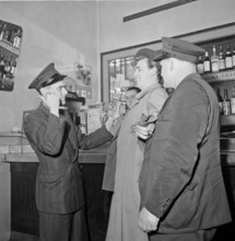 Drivers of the Welti-Furrer taxi escorting drunk at home, Zurich 1951