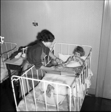 Sick girl in a crib at school for social work, Zurich 1953