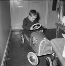 Boy with pedal car at school for social work, Zurich 1953