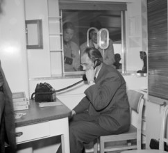 Maiden voyage of MS Linth on Lake Zurich, man on the phone 1952