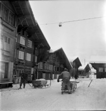 Men removing snow from a street in Saanen 1948