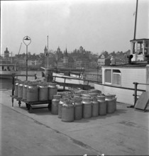 Lucerne, milk cans ready to transport by ship, Lake Lucerne 1940