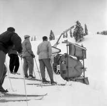 Helicopter crash, people on skis watching the wreckage near St. Antonien 1954