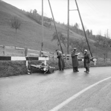 Policeman making the accident report, motorbike accident near Trogen 1956
