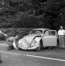 Car, hood dameged in an accident near Gruyere 1959