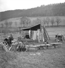Motiers, house shorting, household effects of a homeless person outdoors 1948