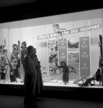 Passersby watching Swiss Ski association membership promotion in Zurich 1950