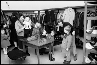 Shopping at a second hand clothes shop, 1968