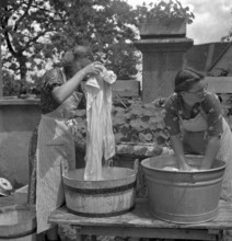 Washing clothes outdoor at women's school 'Heim' in Neukirch an der Thur, 1940