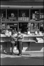 Boys buying sweets at a kiosk, Zurich 1966