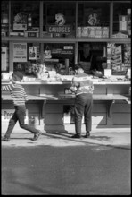 Boys buying sweets at a kiosk, Zurich 1966