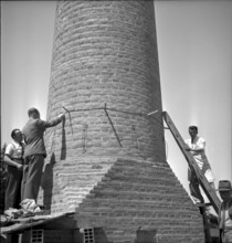 Factory chimney blasting in Geneva: fuse attachment, 1943