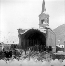 Dilapidated church blasting in Saas Fee, onlookers watching the demolished nave 1959