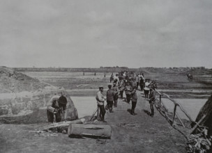 Construction of a bridge by sappers of the 16th Engineer Battalion near the town of Maimaikai
