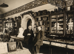 Sergei Timofeyevich Morozov (1863-1944, right) in the interior of the Handicrafts Shop 1925