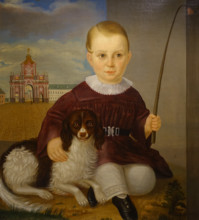 Portrait of a boy with a dog against the background of the Red Gate in Moscow