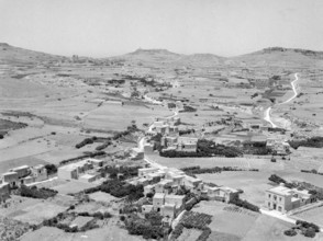 View from citadel in Victoria over countryside looking towards Ghasri and Giordan lighthouse in distance.