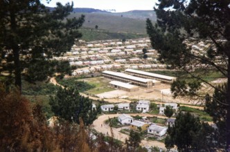Erica township (or location), an area of mass housing development located in the hilly region near Knysna or Plettenberg Bay in the Western Cape of South Africa.