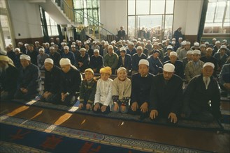 CHINA, Gansu Province, Lanzhou, Muslims in Mosque praying at Ramadam