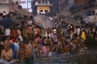 INDIA, Uttar Pradesh, Varanasi, Sivaratri Festival crowd bathing in the River Ganges.