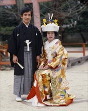 JAPAN, Honshu, Kyoto, Traditional wedding.  Portrait of bride and groom.