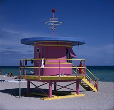 USA, Florida , Miami,  South Beach. Colourful Lifeguard tower on sandy beach
