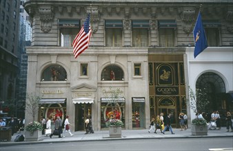 USA, New York , New York, Manhattan’s 5th Avenue Christian Dior shopfront with pedestrians walking