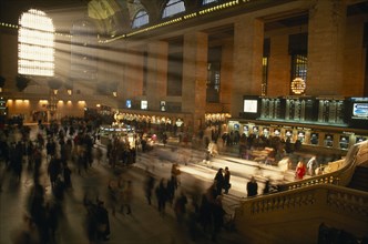 USA, New York State, New York, Grand Central station ticket hall at rush hour with light streaming