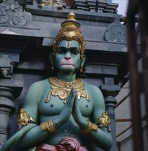 SINGAPORE, Sri Ramar Sannadhi, Close up of colourful statue of green monkey god Hanuman