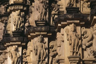 INDIA, Madhya Pradesh, Khajuraho, Kandariya temple c1050 detail of Hindu carvings