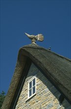 ENGLAND, Worcestershire, Bretforton, Thatched bird on top of thatched roof
