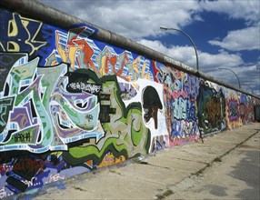 GERMANY, Berlin,  Berlin Wall, Preserved section with graffitti