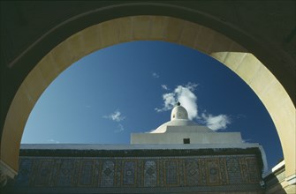 TUNISIA, Kairouan, Mosque dome seen through arch