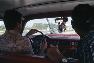 CUBA, Transport, Interior of car with image of Che Guevara hanging beneath front windowscreen