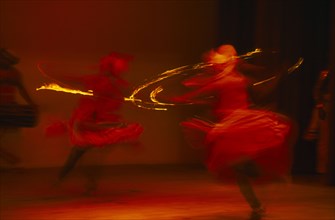 SRI LANKA, Kandy, Kandy dancers in movement blur
