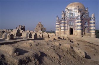PAKISTAN, Uch Sharif, Tomb of Bibi Jawindi with domed roof and two similar crumbling buildings with
