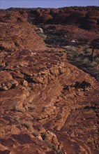 AUSTRALIA, Northern Territory, Kings Canyon, View over ridge of red rock canyon landscape