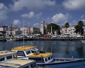 BARBADOS, Bridgetown, "The Carenage seen from across the sea  with buildings,church tower,cars,