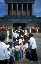 VIETNAM, Hanoi, Children lining up to enter the Ho Chi Minh Museum and Mausoleum.